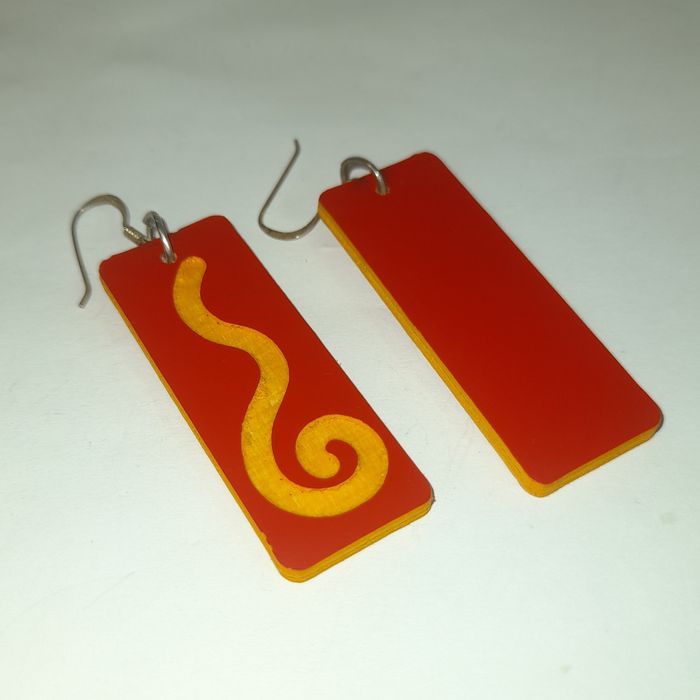 Wooden earrings in the shape of spirals.