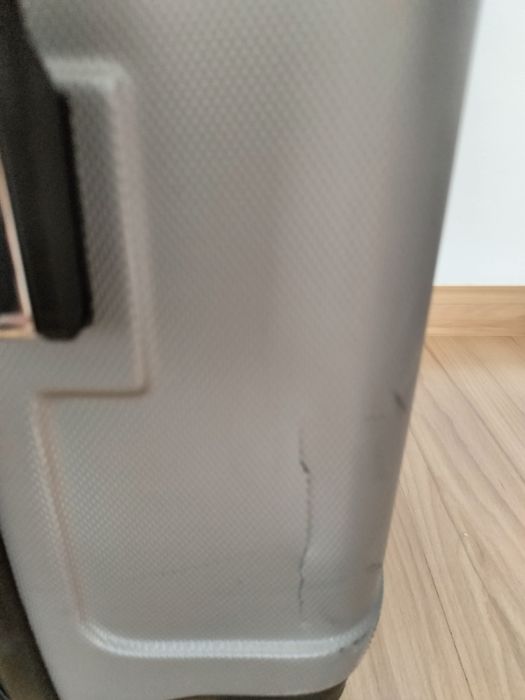Srebrna średnia walizka M/XL  marki RGL