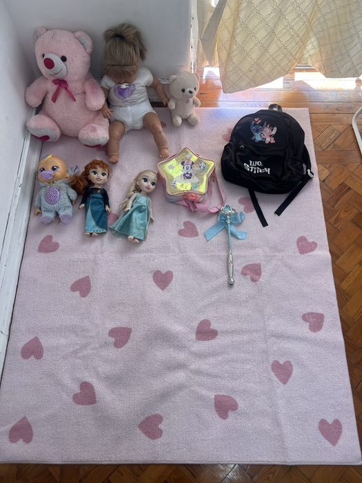 Carpet with few toys and bags