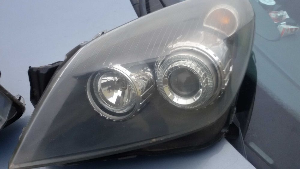 Lampy przednie Opel Astra H