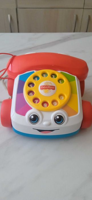 zabawka, telefon na kółkach z mrugającymi oczami i tarczą...