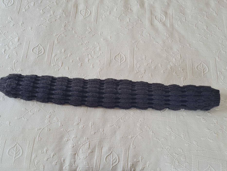 Casaco bolero com efeitos na malha