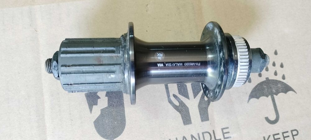 Piasta tylna na tył Shimano DEORE na 32 szprych