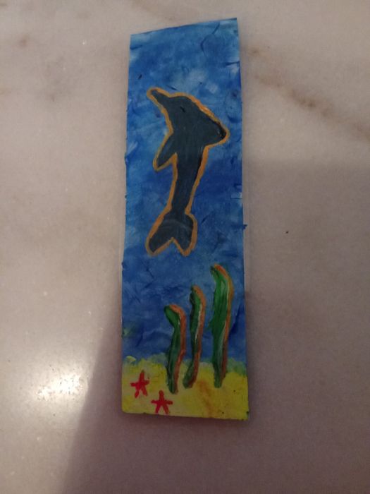 Magiczna zakładka w pomorskim świecie z delfinem.