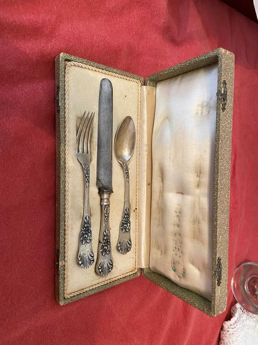 Very old case with a silver cutlery set