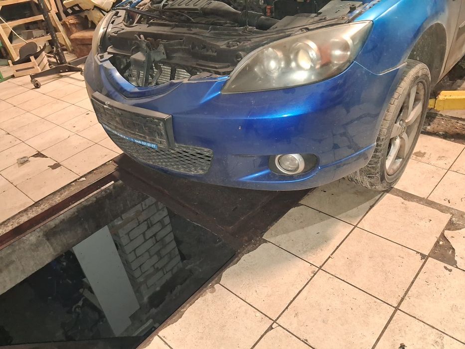 Бампер передній Mazda 3 BK хетчбек 2003 2009