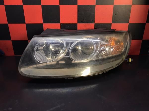 Ótica / farol esquerda HYUNDAI Santa Fé II (CM)