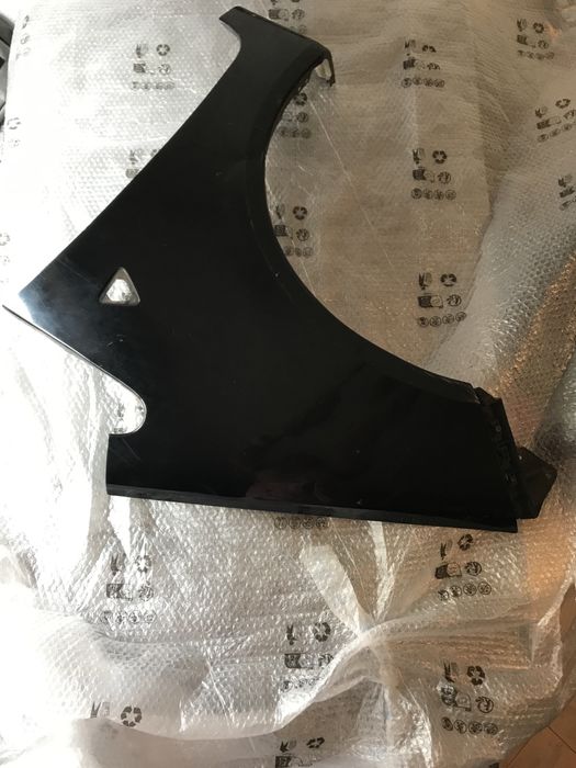 Guarda lamas esquerdo mitsubishi colt