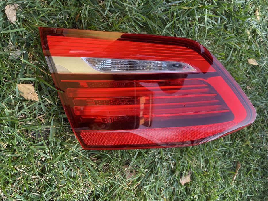 Фара ліва в кришку багажника BMW f45 оригінал LED 731104111