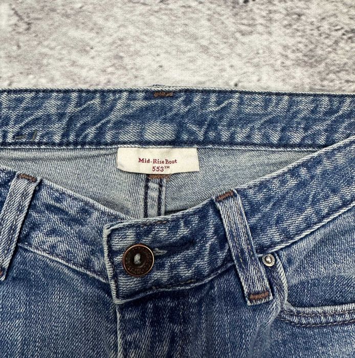 Spodnie jeansowe LEVIS 553 Mid-Rise Boot dzwony damskie szerokie W29