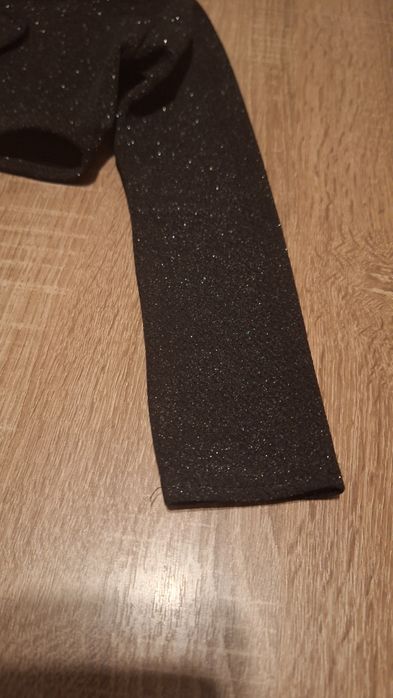 Bolerko czarne z brokatem 116/122