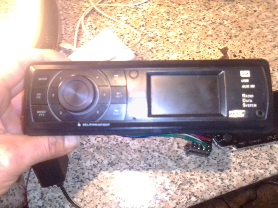 PSP 2, tablet para ver fotos e um radio