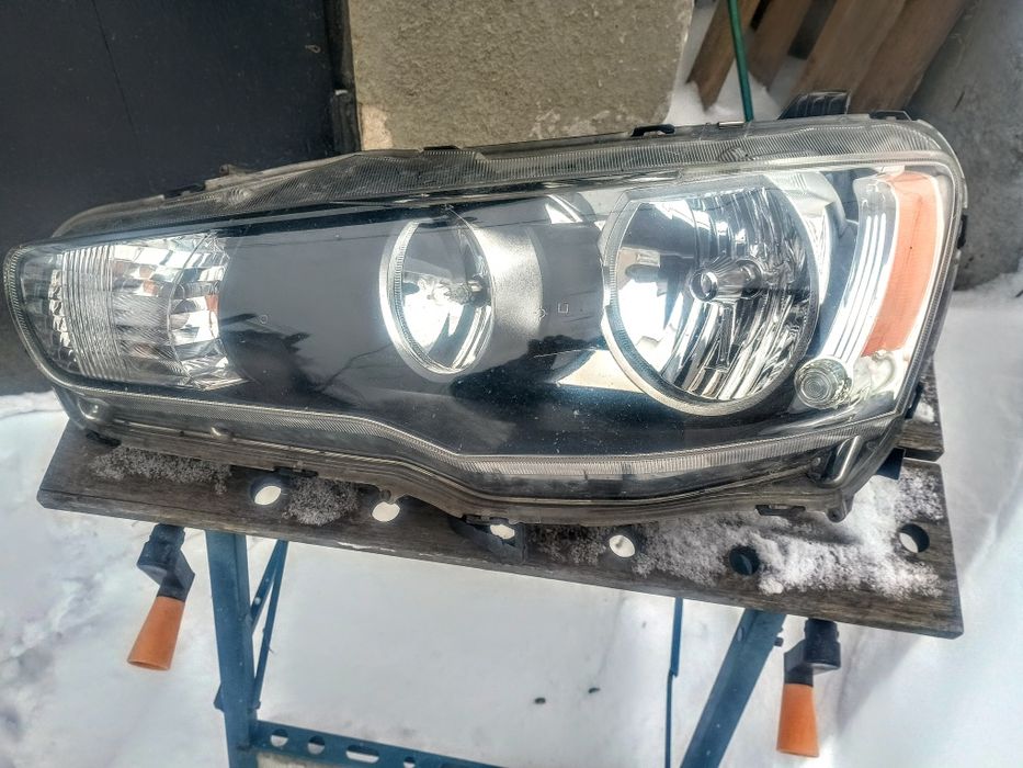 Mitsubishi Lancer VIII lampa przednia lewa Stanley