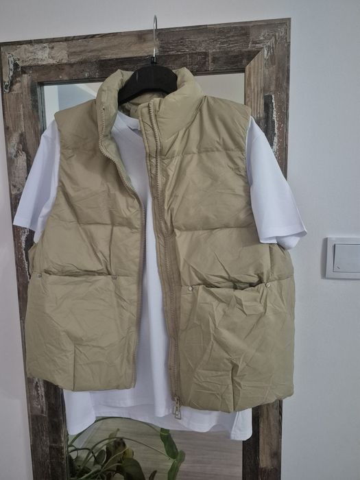 Nowy bezrękawnik z naturalnym puchem.