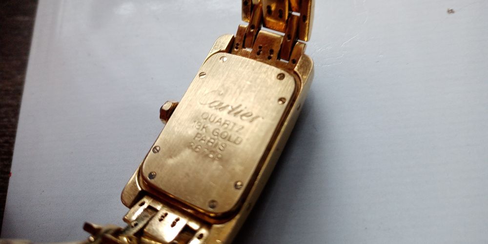 Złoty zegarek, cartier z brylantami, pr.750