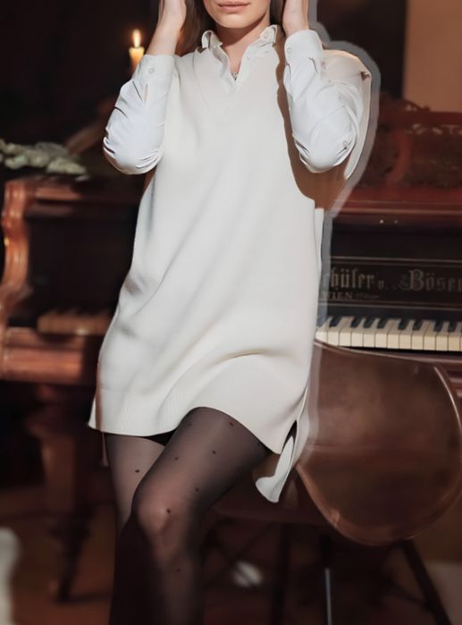 Желетка молочного кольору, тепла