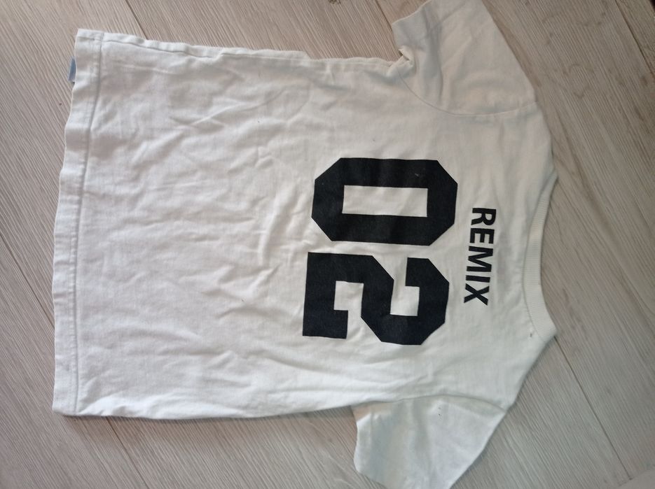 Biała bluzka z numerem 110/116