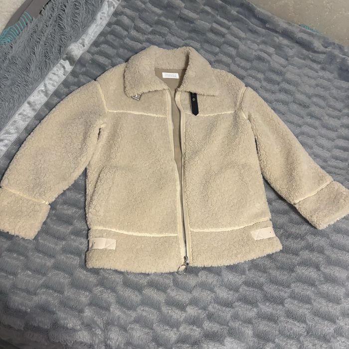 Дубльонка молочного кольору