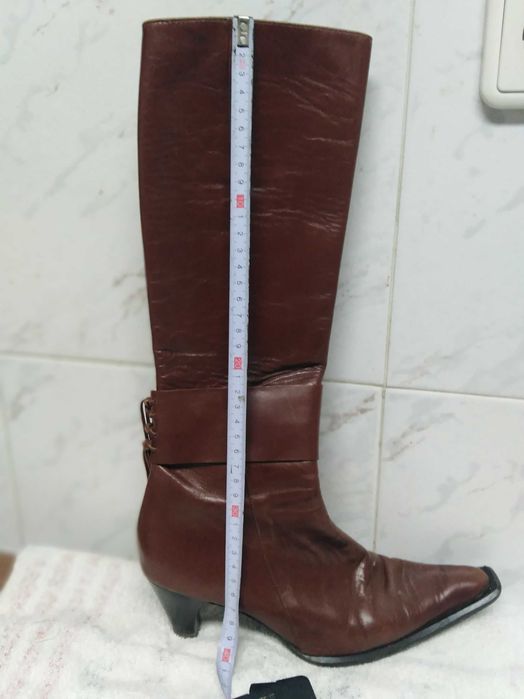 Botas cano alto pele