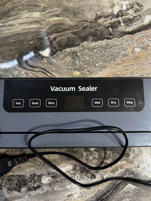 Вакуумний пакувальник