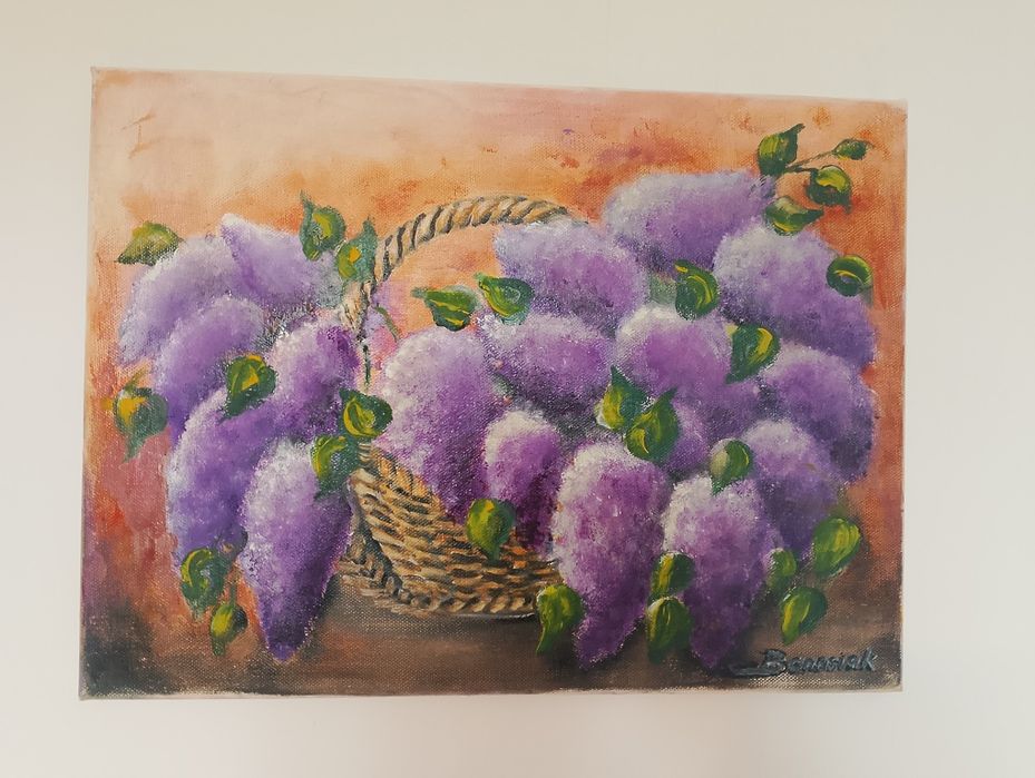 Obraz kwiaty bzu w wiklinowym koszu