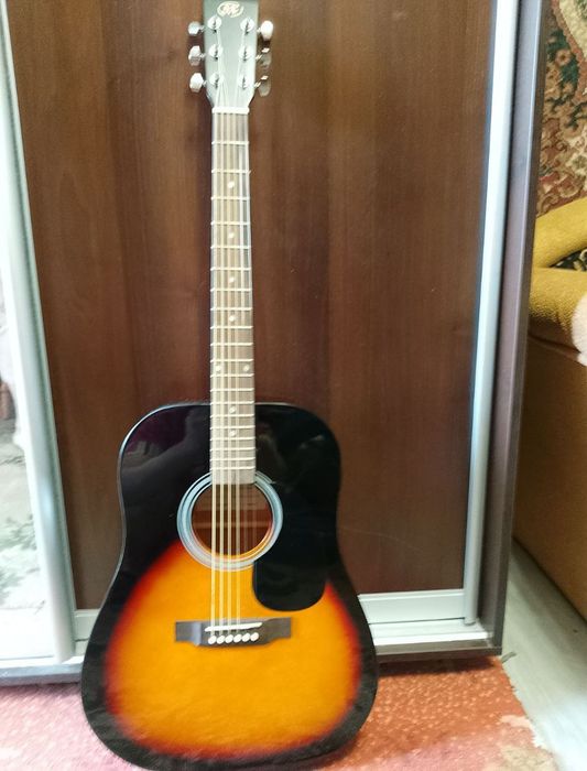 Продам новую акустическую гитару SX