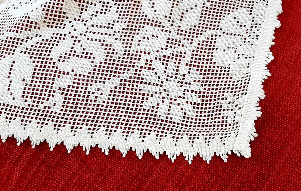 Lace-trimmed beige tablecloth