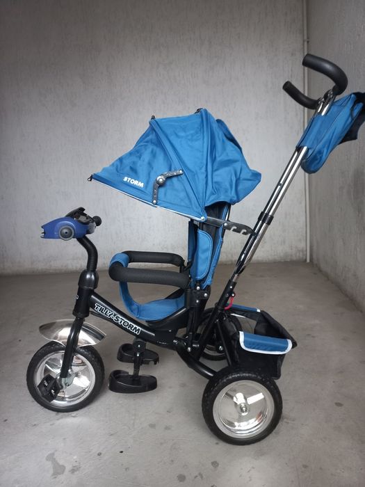 Трёхколёсный велосипед-коляска с родительской ручкой Tilly Storm.