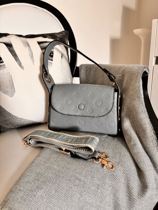 New beige suitcase with two types of handles