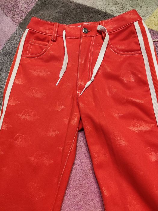 Spodnie adidas fiorucci czerwone.
