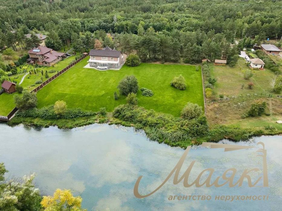 Продаж будинку площею 418,6 м² з виходом до води на ділянці 50 соток у КМ Dream Village, с. Лебедівка