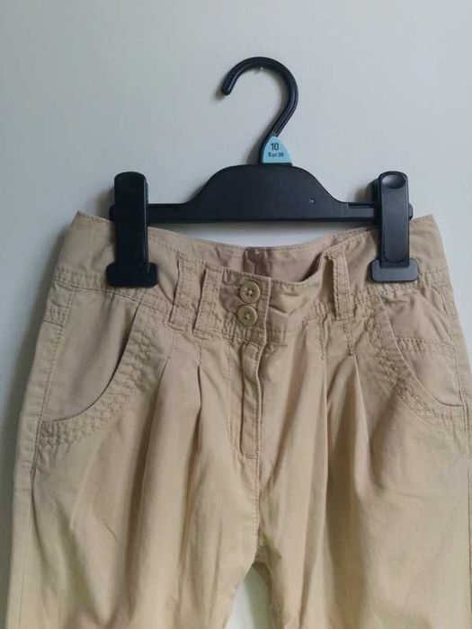 Długie spodnie beżowe lekkie przewiewne wiosenne letnie Next 122 7 lat