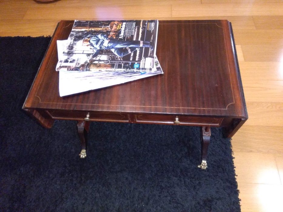 Drop-leaf table with drawers.