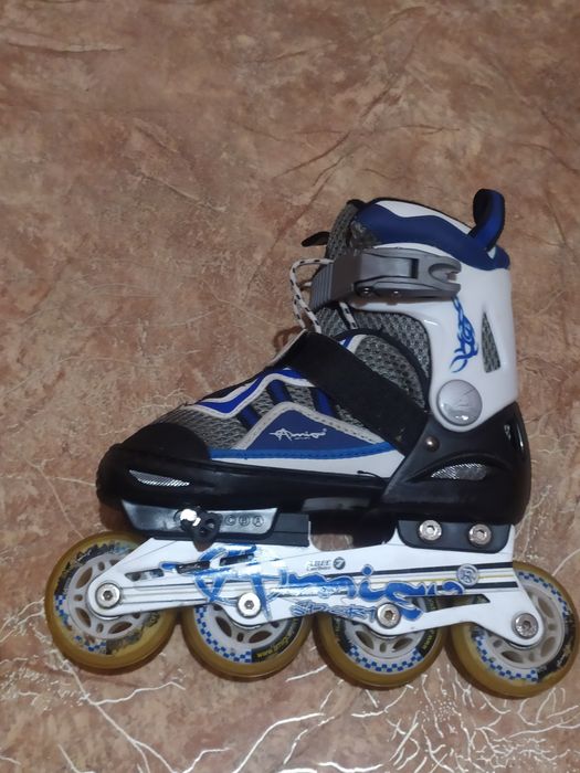 Роликовые коньки