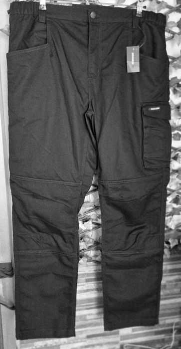 New Black Multi-Pocket Work Trousers
Elastic Waistband Size 50
Made in