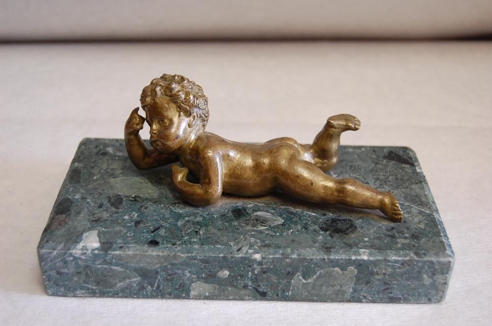 Figurka z brązu dziecka , złocona , dług. ok. 20 cm. Zamienię