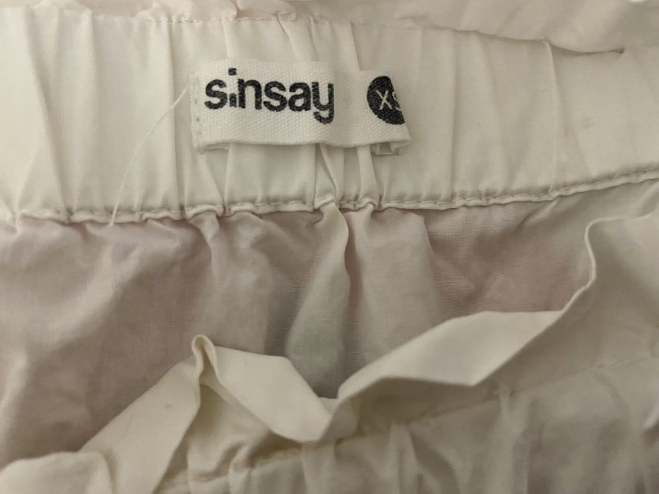 Biała bluzka z kokardkami