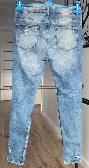 Spodnie jeansowe rurki z dziurami przetarciami 38 M Cropp