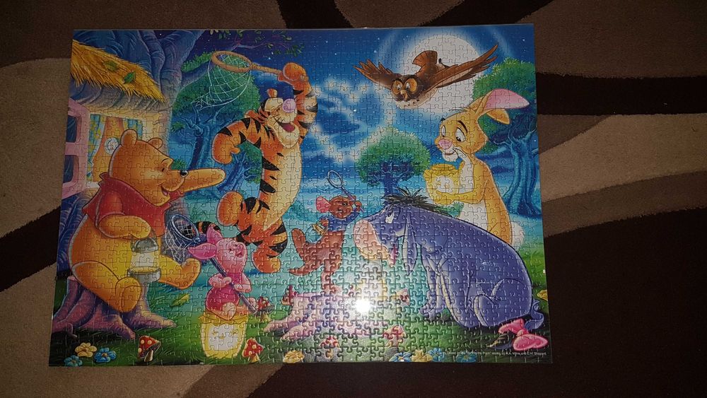 Puzzle w antyramie 1000 el. Ravensburger Kubuś Puchatek łapie świetlik