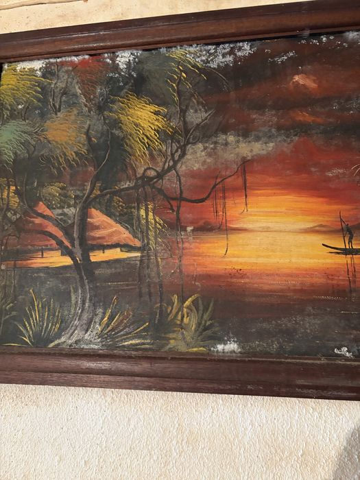 Quadro decorativo com uma pintura de uma paisagem tropical ao pôr do sol, semelhante a obras de arte de ilhas tropicais com palmeiras e barcos