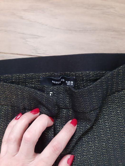 Spodnie w złote paski Reserved 38