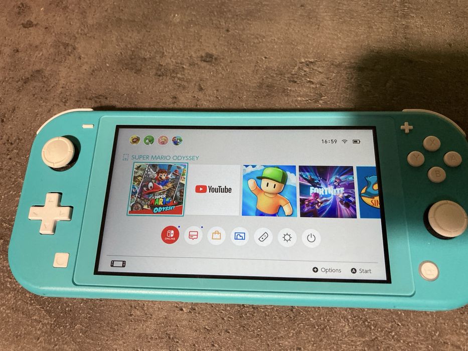 Nintendo Switch Lite 128 GB * stan jak nowy * oryginalna ladowarka *
