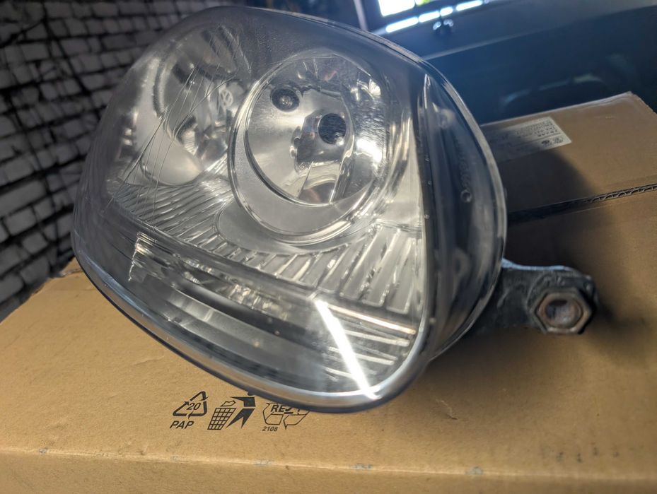VW Golf V lampy reflektory OE 1K6941005P 1K6941006P KPL
