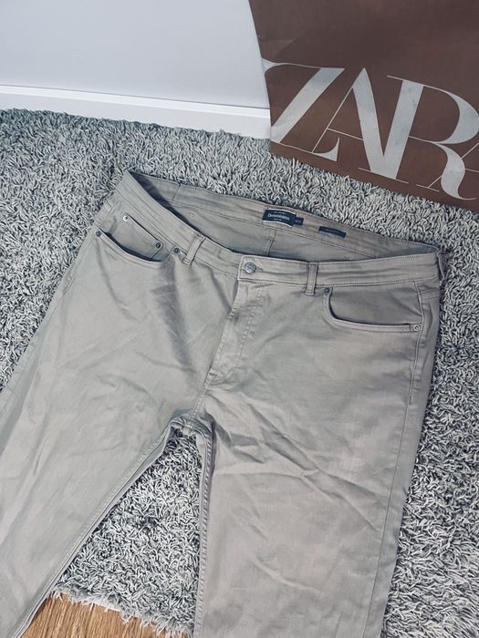 Meskie spodnie jeansy bezowe Dressmann rozm 42/43