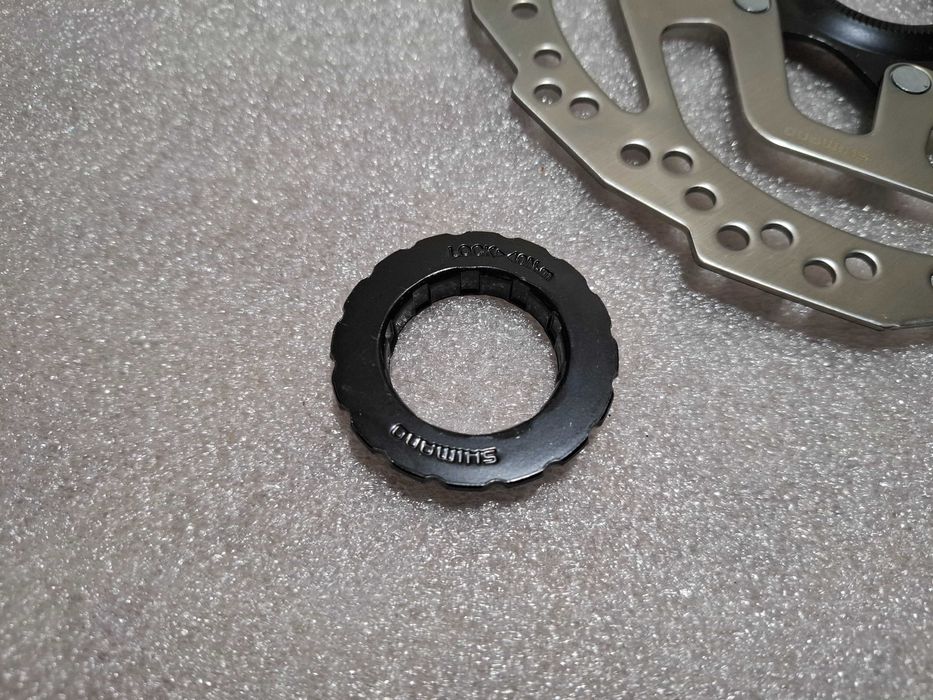 Tarcza Hamulca Rowerowego Shimano SM-RT10 180 Nowa Centerlock Nakrętka