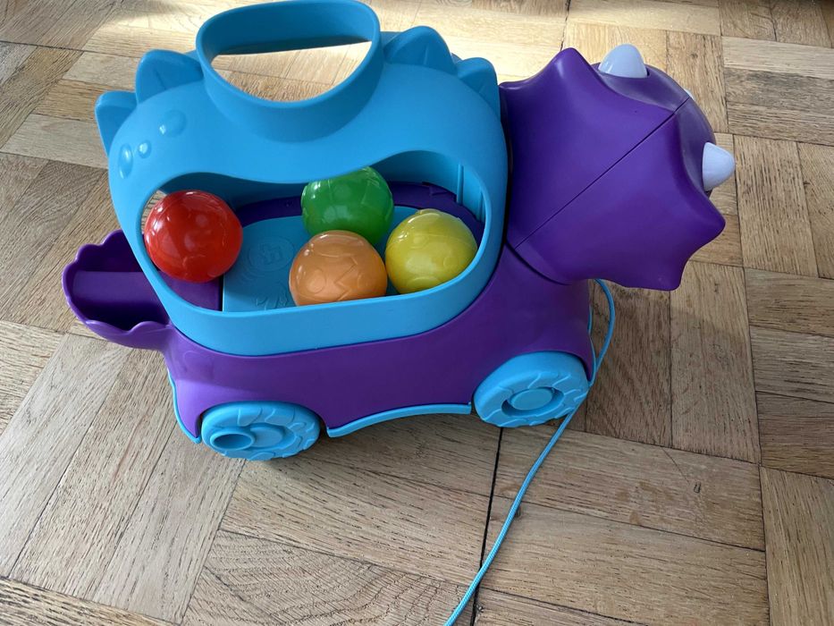 Іграшка каталка Fisher price динозавр веселий трицератопс