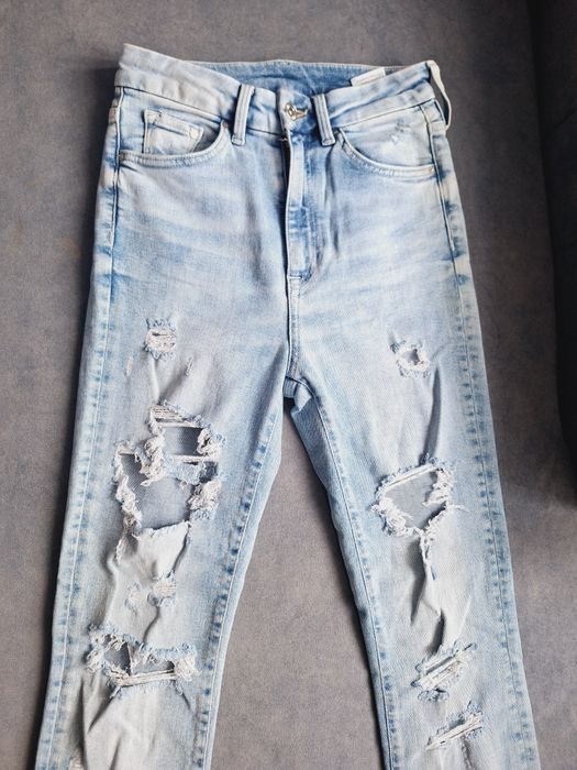 Nowe spodnie damskie jeansy dżinsowe z przetarciami rozmiar 25 XXS/XS