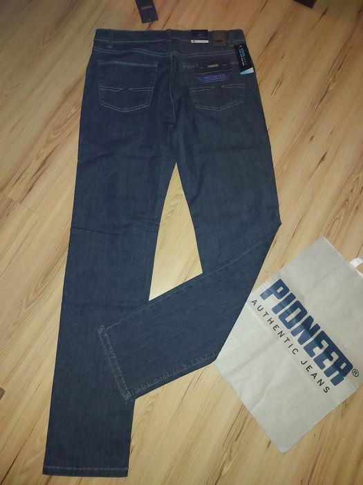 Nowe spodnie jeansowe  rozm.35/34