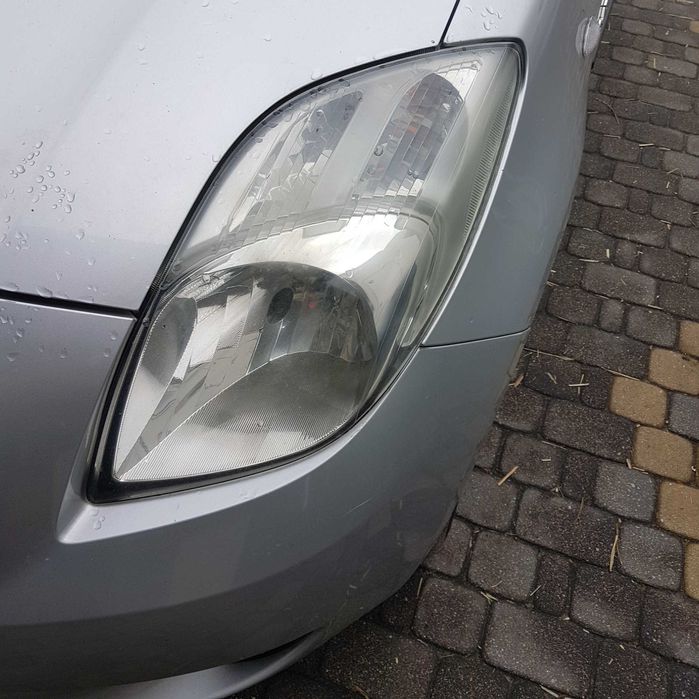 lampa reflektor toyota yaris II 2 08r P9 oryginał