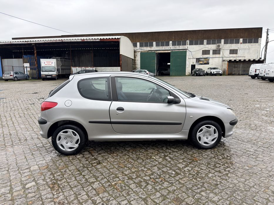 100 mil kms 206 comoletamente nova